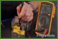 How do you test a Honeywell gas valve with a multimeter?